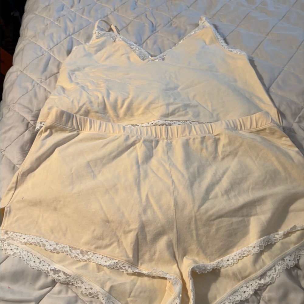 SKIMS Cream Romance Lace Cami and Short Set.